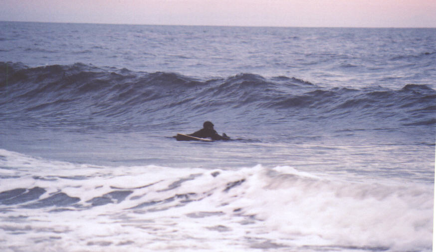 Tommy paddling for the waist high.